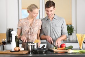 Man and Women using the right Kitchen Countertop for cooking